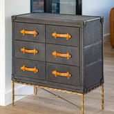 Luxury Albi Dresser upholstered in matte navy leather with six drawers and deep brown handles, supported by a wrought iron frame for a stylish mid-century modern storage solution.